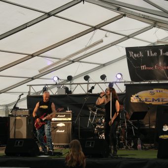 The band playing on stage.