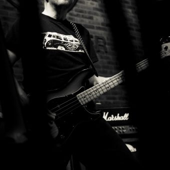 Richard playing bass, in black and white.