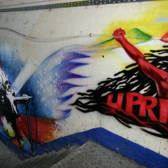A mural graffiti design of the word 'uprising'.