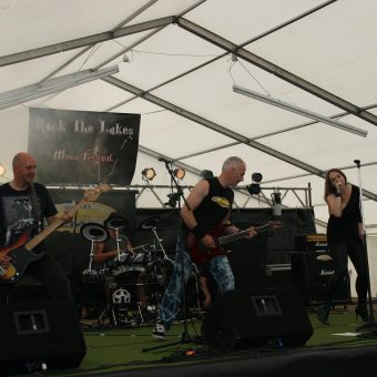 The band playing on stage.