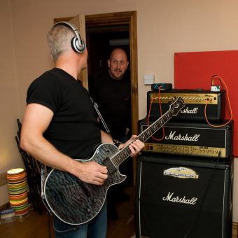 Richard interrupting Neil recording at the studio to tell him to turn it down.